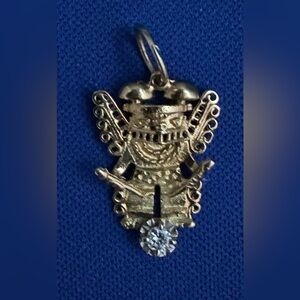 14K yellow gold pendant with small diamond.